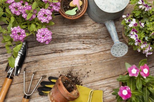 Gardener starting a tidy-up in a Cranford front garden